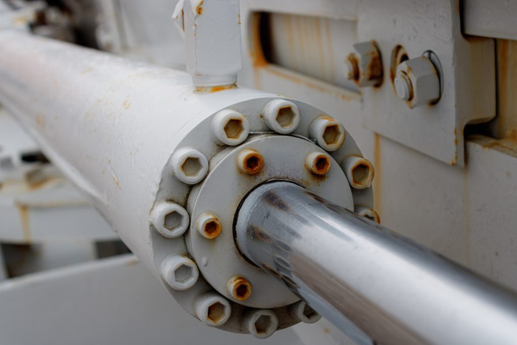 a close up of a white pipe on a machine